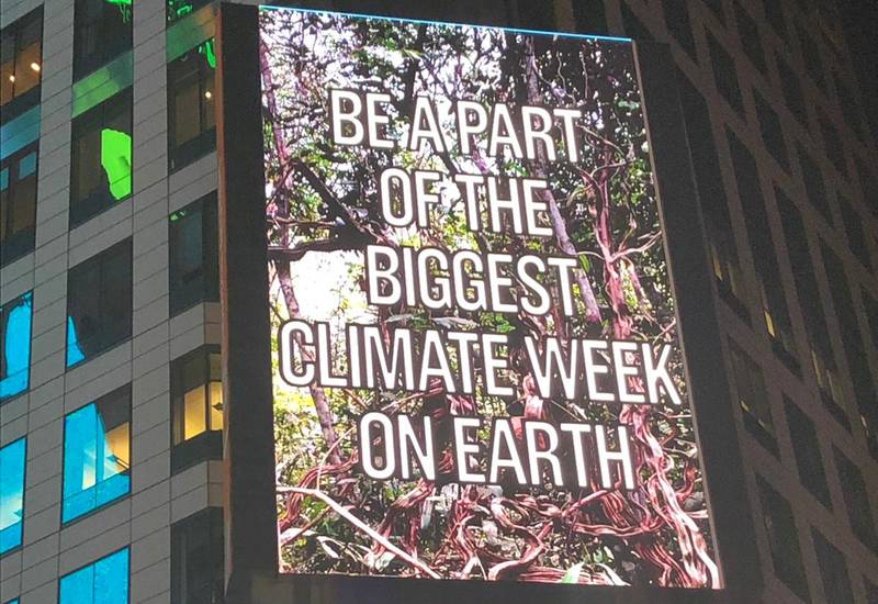 billboard sreen showing be part of the biggest climate week on earth