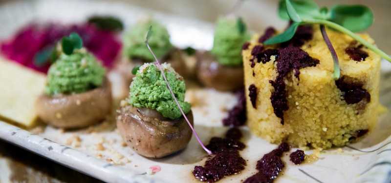 A plate of delicious food and green veggies.