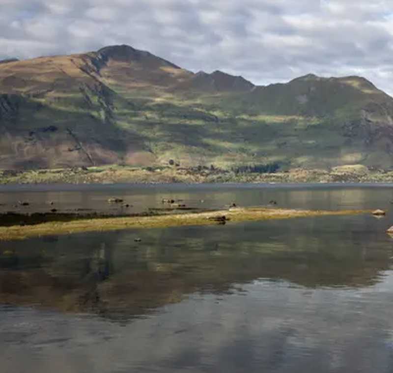 Beautiful lake surrounded by towering mountains.